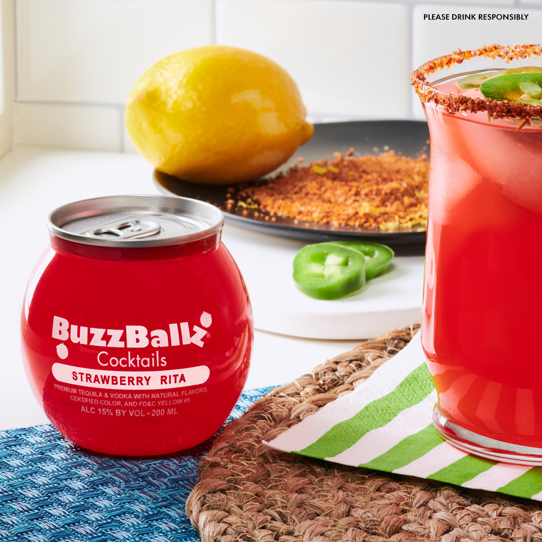 Sweet and spicy, a combination that is unmatched. Try this Strawberry Jalapeño ‘Rita recipe this week!

1 muddled, de-seeded jalapeño
1 sliced jalapeño
2 Strawberry ‘Rita BuzzBallz
Tajin
Zest of one lemon
1 Lime for rimming
Ice

In a shaker, muddle one de-seeded jalapeño. For best results, remove the skin and muddle the pulp. 
Add in the Strawberry ‘Rita BuzzBallz. 
Shake well. 
Onto a plate, pour a bit of Tajin for rimming.
For a little added brightness in flavor, zest one lemon into the Tajin. 
Rim each glass with lime juice and place the rims in the salt/zest mixture. Pour ice into each margarita glass. 
Pour the mixture through the shaker’s strainer over the ice. 
Place a few slices of jalapeño in each glass for more flavor and added garnish.