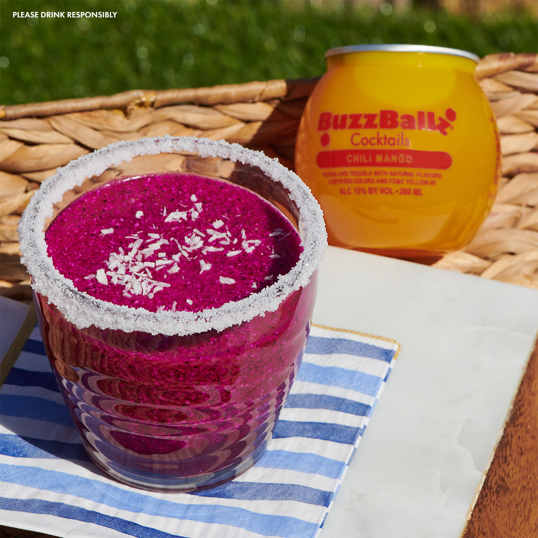 Looking for a little more  this summer? We have just the recipe for you. Get your hands on some of our Chili Mango BuzzBallz and make this Spicy Mango and Dragon Fruit Slush.

½ cup of frozen dragon fruit
1 Chili Mango BuzzBallz
1/4 cup of shredded coconut for rimming
¼ cup of shredded coconut for blending
Simple syrup for rimming

In a blender, blend 1 Chili Mango BuzzBallz, ½ cup of frozen dragon fruit and ¼ cup of shredded coconut until smooth. 
Cover the surface of a small plate with simple syrup. 
Press the rim of the glass into the simple syrup and hold for 10 seconds. 
Then, press the rim of the glass into the plate of shredded coconut for 10 seconds to ensure it sticks. 
Pour the blended cocktail into the glass