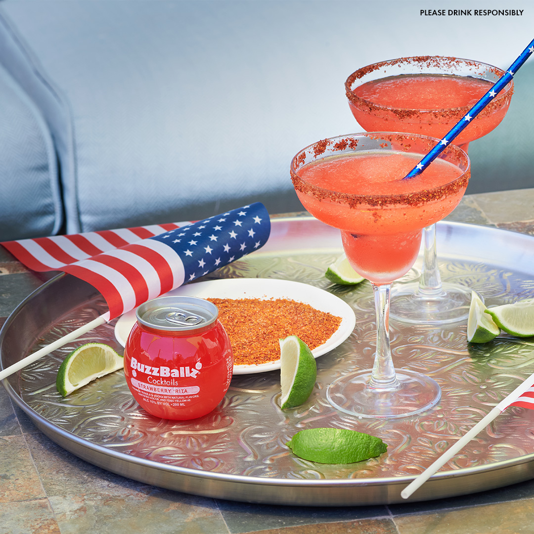 ‘Rita, white, and blue - all day today! Cheers to the U.S.A. with this classic Frozen Strawberry Margarita.

1 BuzzBallz Cocktails Strawberry ‘Rita
Lime wedge
Tajin
Ice

Pour Tajin onto a saucer
Wipe lime around margarita glass rim
Dip the rim into the Tajin
Fill a blender half full with ice and the whole BuzzBall
Blend until smooth
Pour into margarita glass